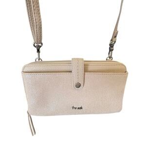 The Sak Iris Smartphone Wallet in Metallic Silver Crossbody Wristlet